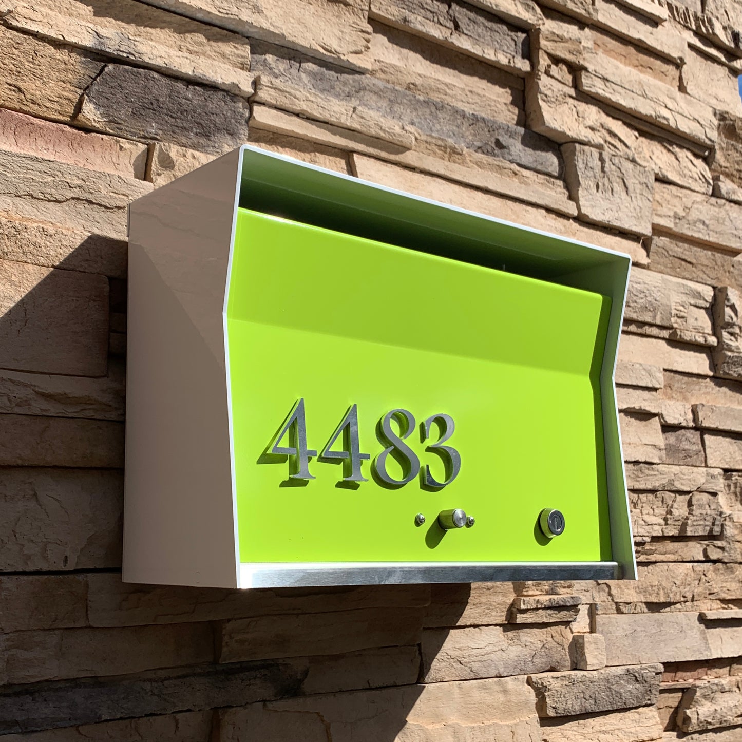 Wall Mount Mailbox mounted to outdoor wall. RetroBox in arctic white and lemon lime