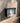 Wall Mount Mailbox mounted to outdoor wall. RetroBox in jet black and stainless steel