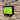 Wall Mount Mailbox mounted to outdoor wall. RetroBox in jet black and lemon lime