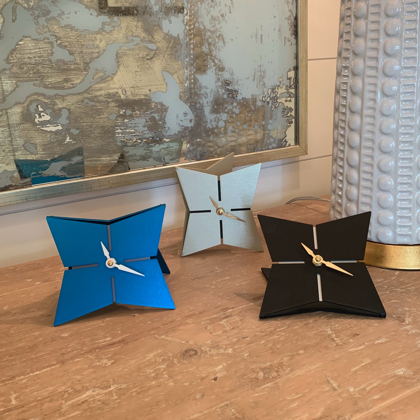 The StarFish Clock Modern Desk Clock in aqua, jet black and mid-century gold