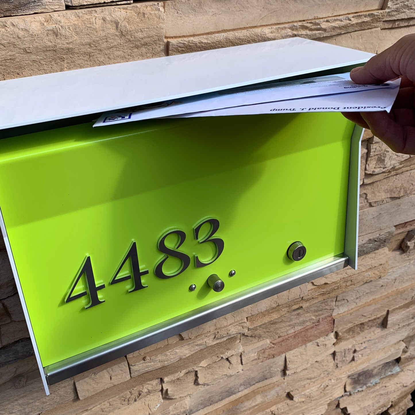 Wall Mount Mailbox mounted to outdoor wall. RetroBox in arctic white and lemon lime