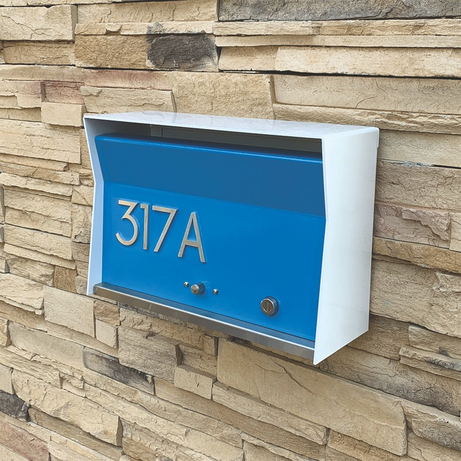 Wall Mount Mailbox mounted to outdoor wall. RetroBox in arctic white and aqua