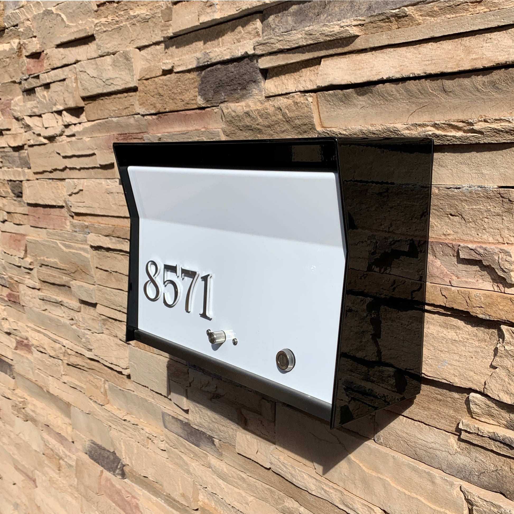 Wall Mount Mailbox mounted to outdoor wall. RetroBox in jet black and white