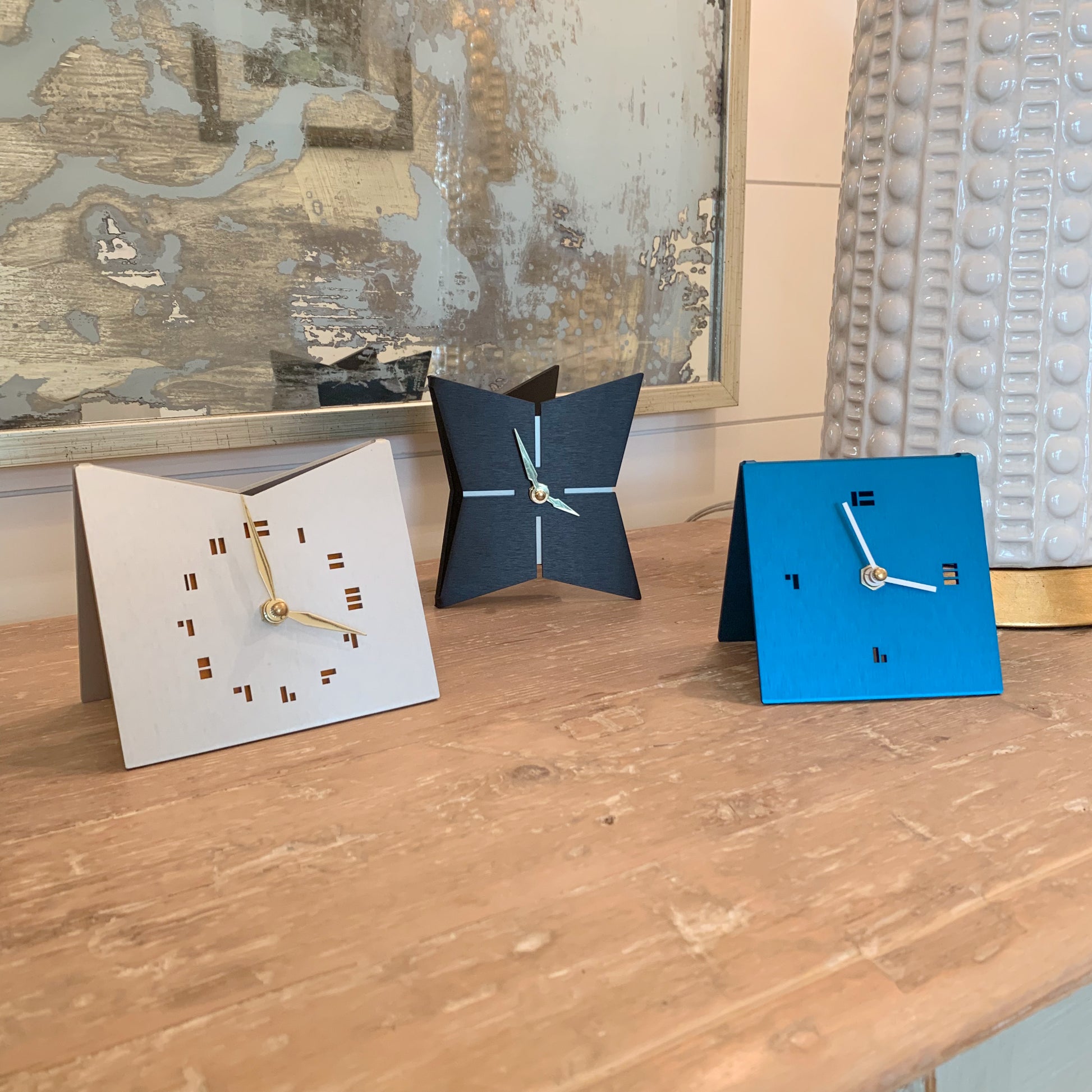 The SimpleDesk Clock Modern Desk Clock in jet black, aqua, and mid-century gold