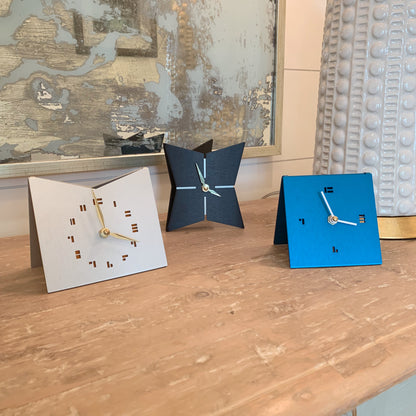 The StarFish Clock Modern Desk Clock in aqua, jet black and mid-century gold