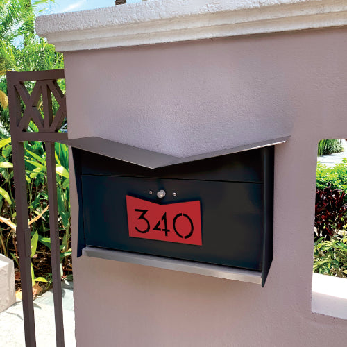 Wall Mount Mailbox mounted to outdoor wall. ButterFly Box in jet black and firecracker red