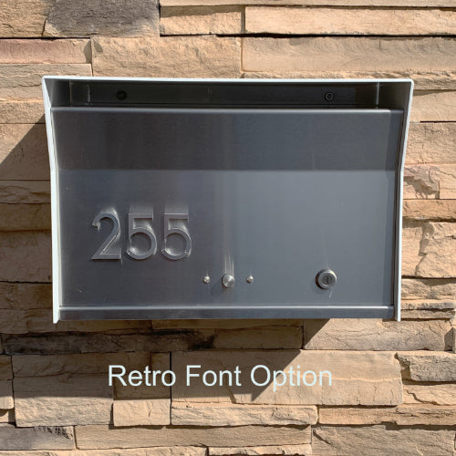 Wall Mount Mailbox mounted to outdoor wall. RetroBox in arctic white and designer grey